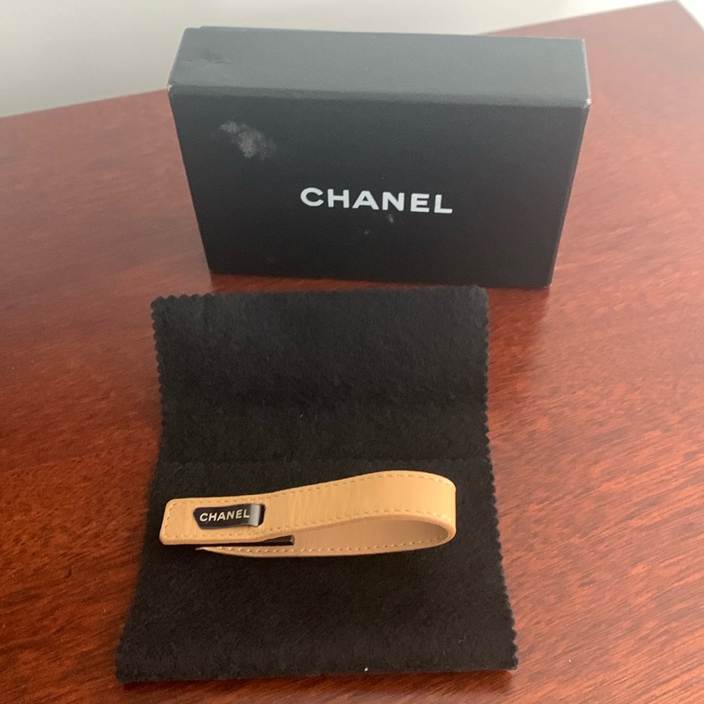 Authentic Chanel women’s bracelet in tan/beige leather strap gently worn